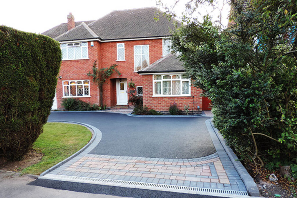 black tarmac driveway with pavers